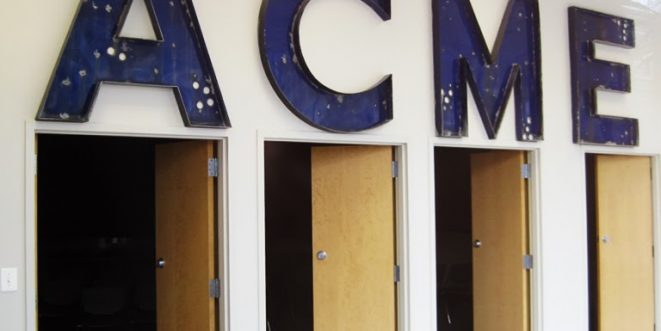 Old and worn "ACME" logo letters, each letter above a tan open door.